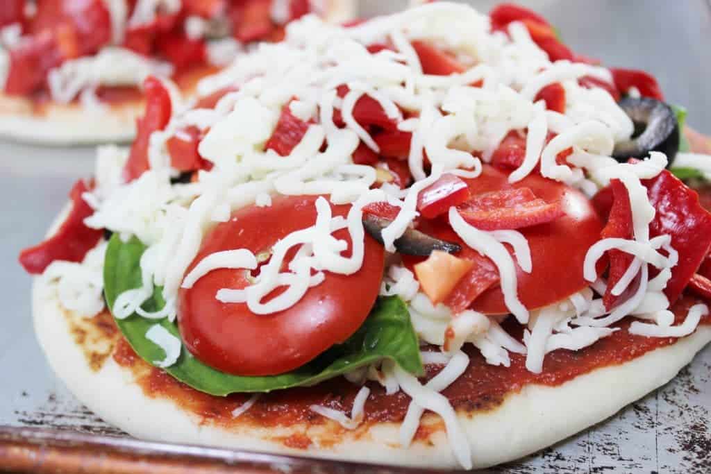 homemade pizzas on Indian Naan bread by https://homemadefoodjunkie.1wp.site