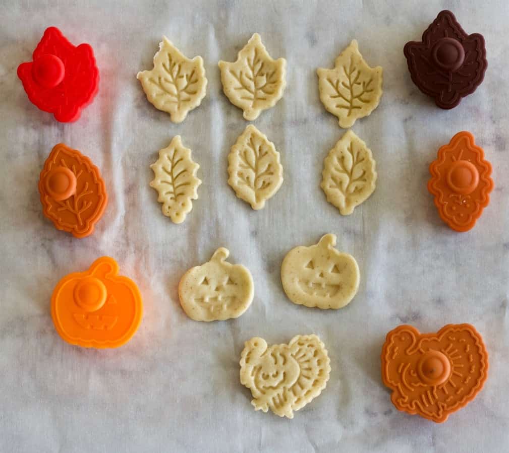 pie dough cut outs and stamps with the raw dough shapes they create