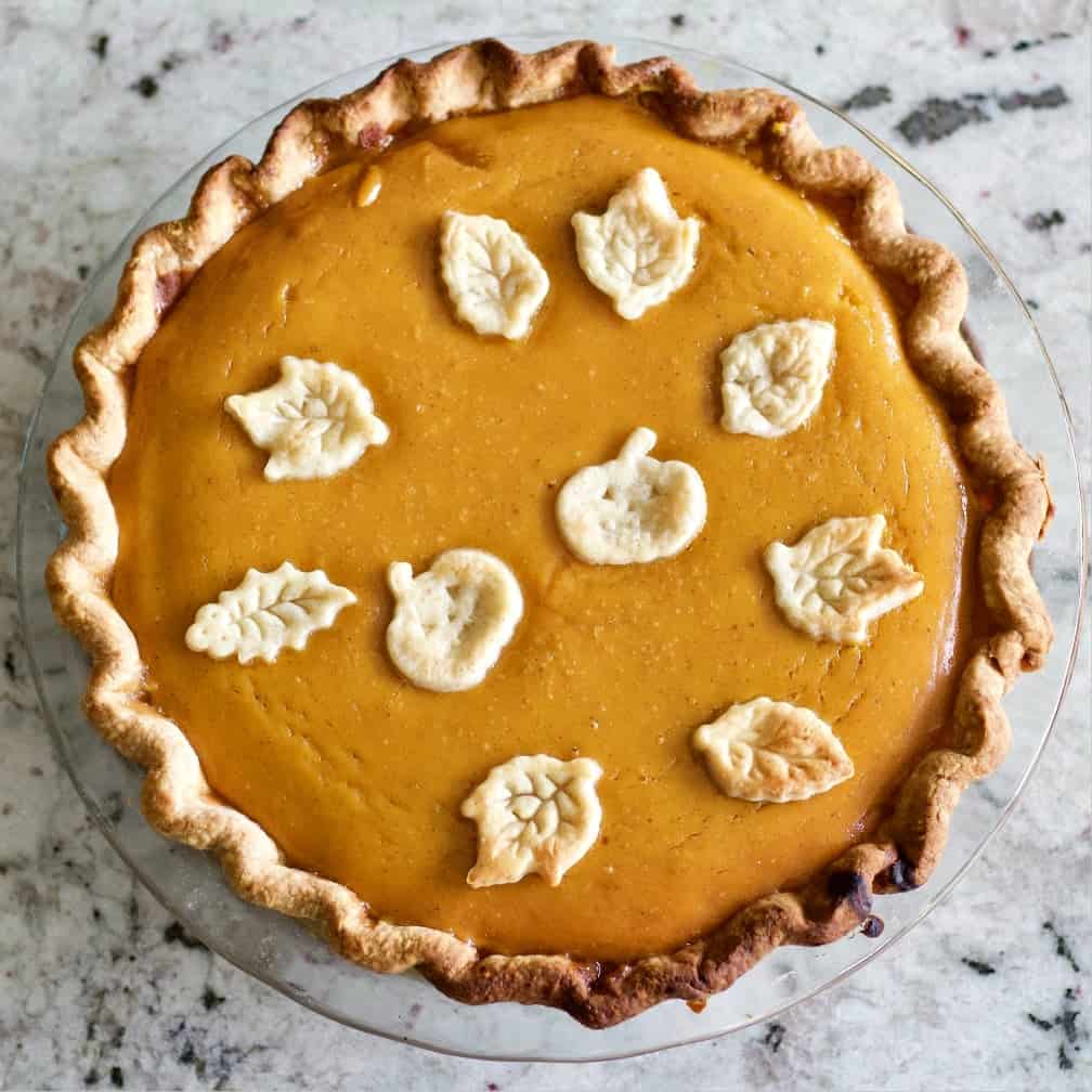 Pumpkin Pie with pumpkin and leaf dough toppers.