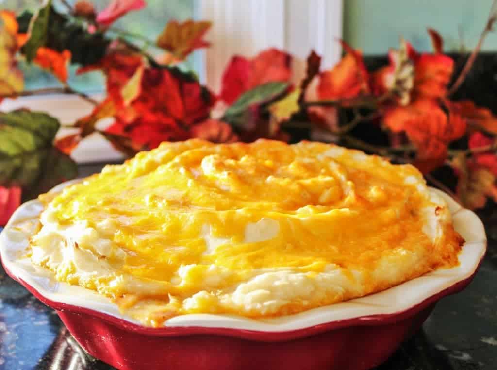 Shepherd's pie has a hamburger filling spiced with a southwestern flair, topped with creamy mashed potatoes and melted shredded cheese. A comforting, filling casserole. https://homemadefoodjunkie.1wp.site