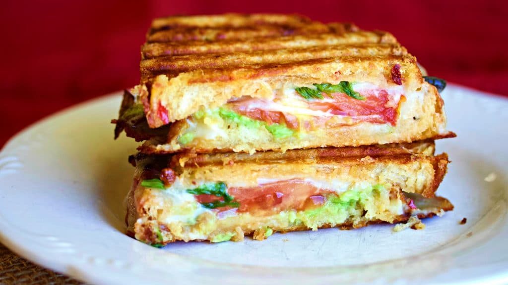 Delicious warm, and melty Southwest toasted cheese sandwich is a flavorful combination of your favorite artisan bread filled with healthy avocados, a delicious homemade Southwest sauce, peppers and bacon melted together with your favorite smoked cheese.