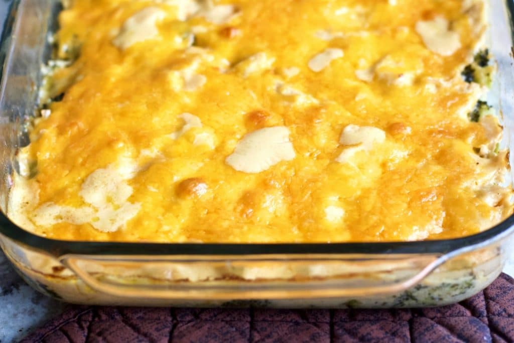 baked chicken mornay casserole showing the cheesy topping and Mornay sauce bubbling through. Yum!