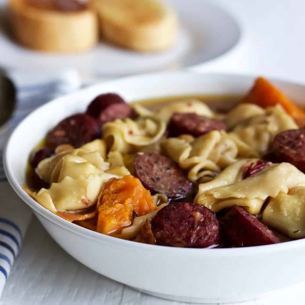Crock pot tortellini sausage soup. An easy, high fiber meal! https://homemadefoodjunkie.1wp.site