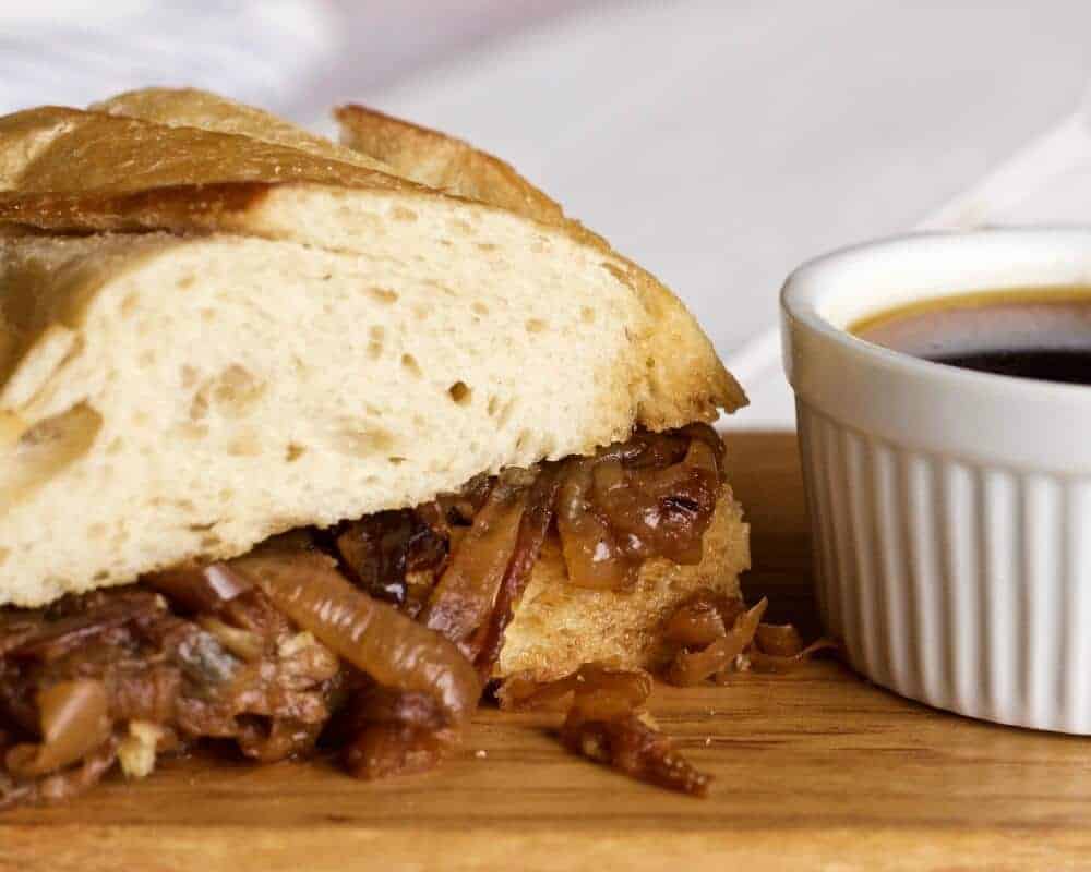 Crock Pot French Dip Sandwich 5 The Crock Pot French Dip Sandwich with Caramelized onions dipped and ready to eat