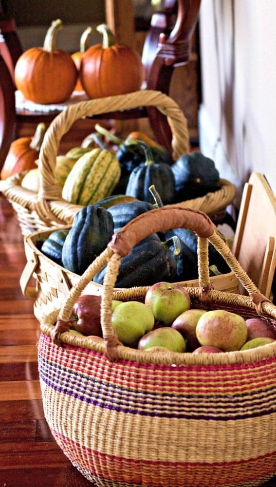 Baskets full of squash and apples