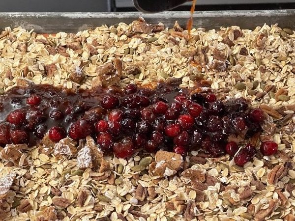 pouring wet ingredients over dry. Pumpkin granola.