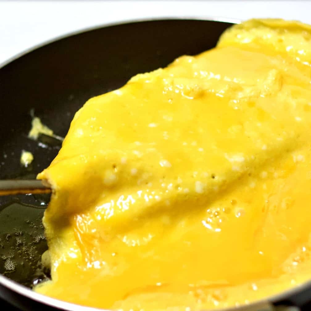Flipping an omelet