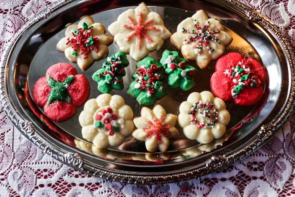 Spritz Cookie recipe with colored doughs and sprinkles.