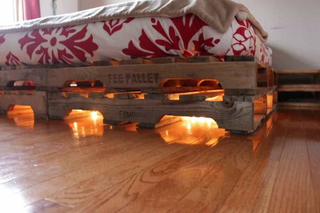 DIY Pallet Bed with tables. Paint it! Sand It! Make it yours! HomemadeFoodJunkie.com