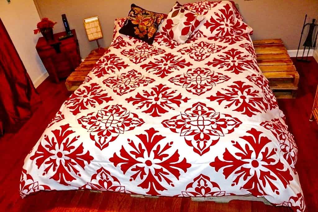 DIY Pallet Bed arranged so you even have attached night stands! homemadeFoodJunkie.com