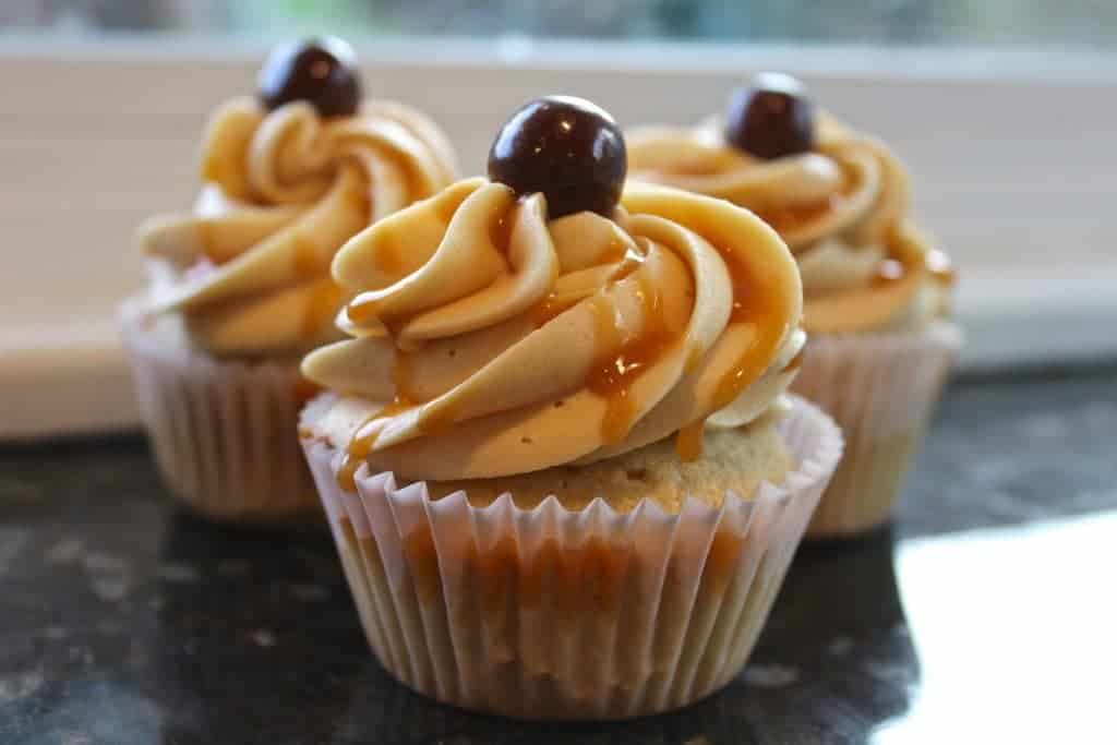 Coffee cupcakes Salted Caramel Buttercream Frosting Decadent coffee cupcakes topped and drizzled with a salted caramel buttercream frosting and garnished with a chocolate covered espresso bean. 