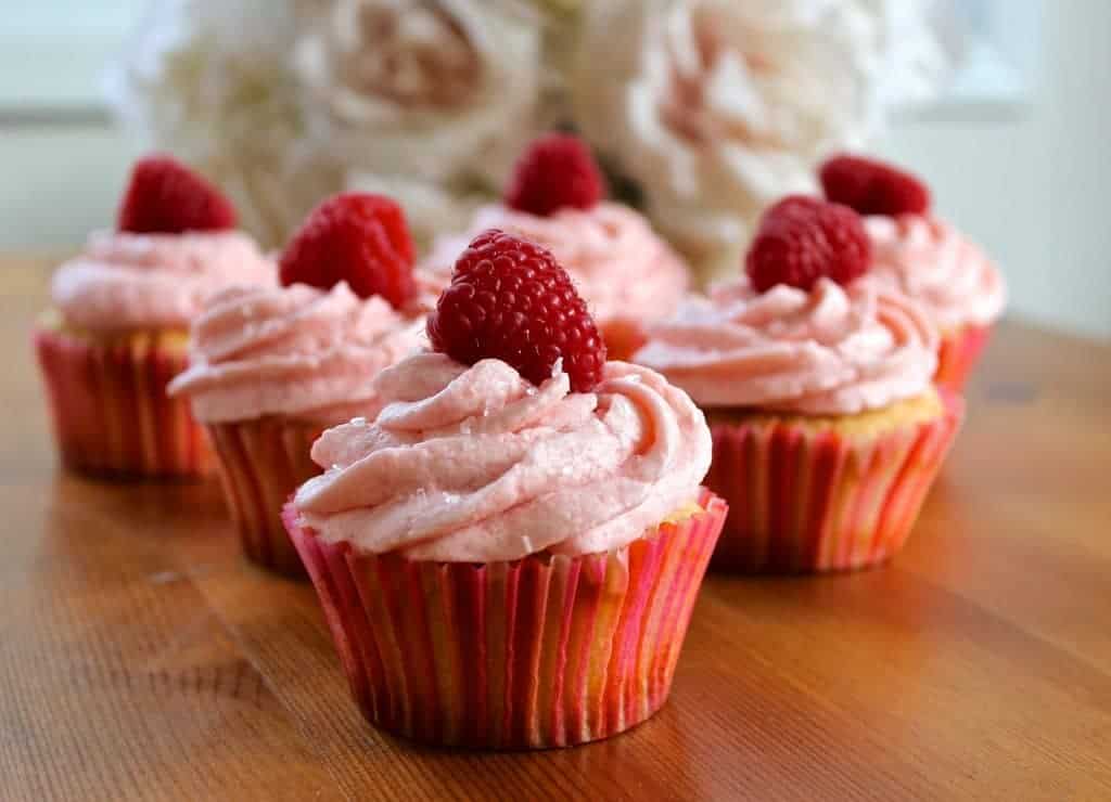 Delectable champagne cupcakes with raspberry buttercream frosting.