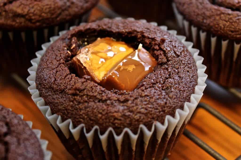 Chocolate cupcakes filled with snickers and caramel sauce