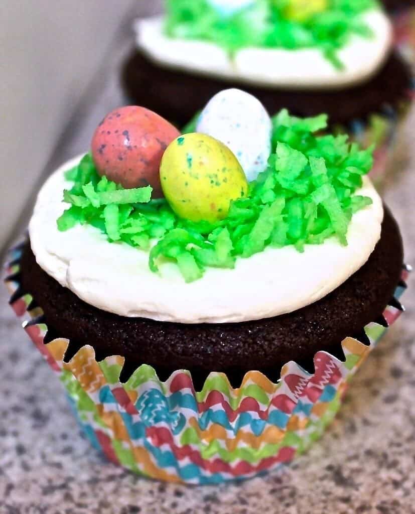 Easter egg hunt cupcakes with a cadbury egg baked into the center of the cupcake