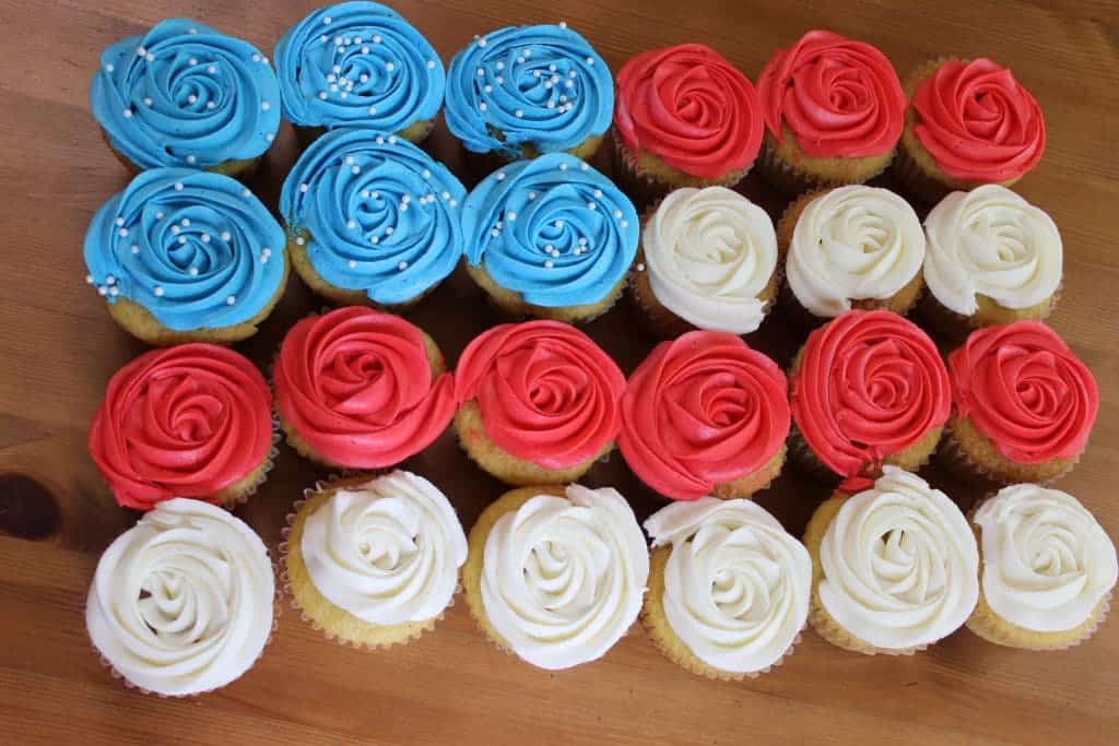 Festive Cherry Almond Cupcakes. A delicious almond cupcake topped with a silky cherry buttercream frosting!