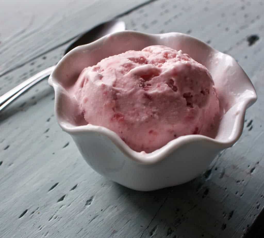 Fresh strawberry Ice Cream is full of blended strawberries added directly into this scrumptious vanilla ice cream recipe. Perfect summer refreshment! https://homemadefoodjunkie.1wp.site