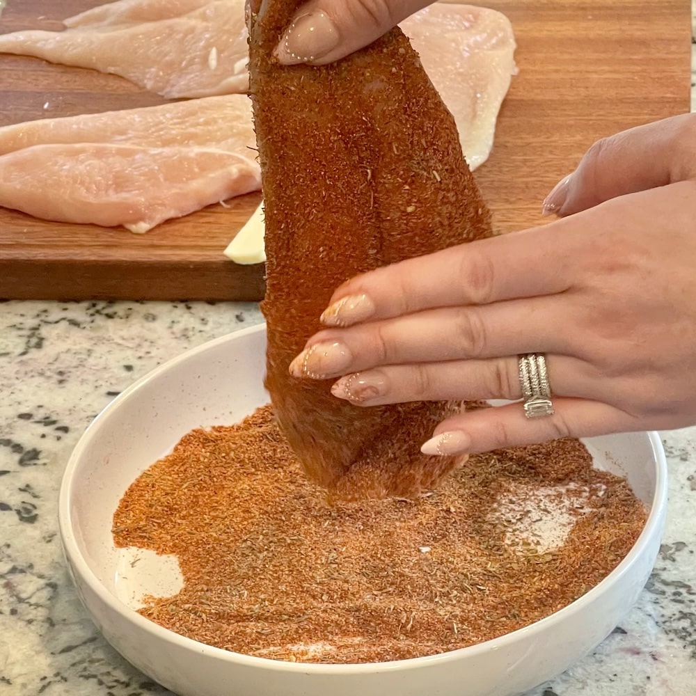 coating chicken with seasonings