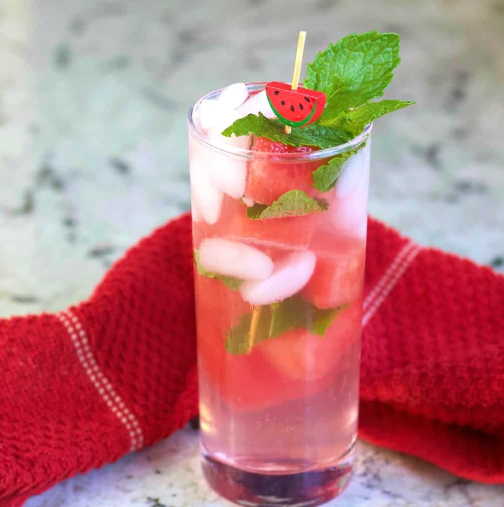 watermelon peach cocktail with a red towel. Showing the garnish
