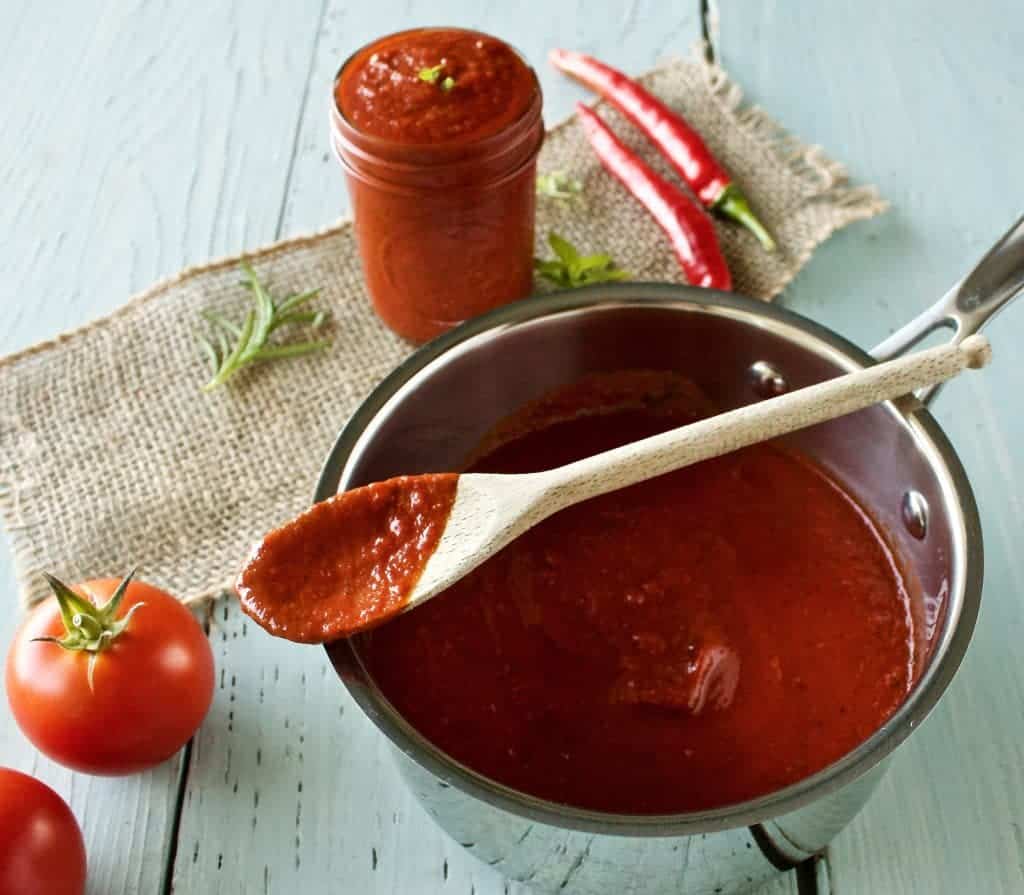 Easy Marinara SauceHomemade Marinara Sauce with balsamic vinegar and sun dried tomatoes is full of delicious flavor and easy to freeze and can. #tomato #tomatosauce #sauce #homemadesauces #marinara #marinarasauce #foodpreservation #gardenharvest #recipe #garden #Peppers #herbs