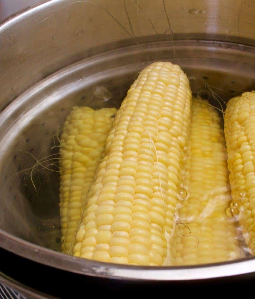 Blanch Corn on the Cob for freezing out of the husk,for longer term freezer storage. https://homemadefoodjunkie.1wp.site