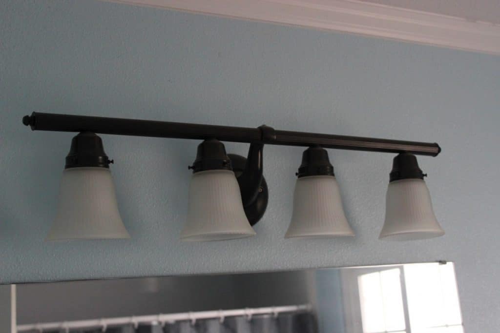 This lovely fixture was gold! we changed it to bronze using the same paint the we used on the fireplace insert