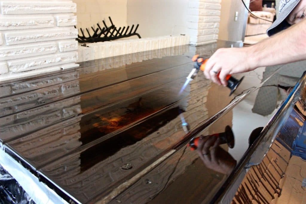 Applying heat to the epoxy layer