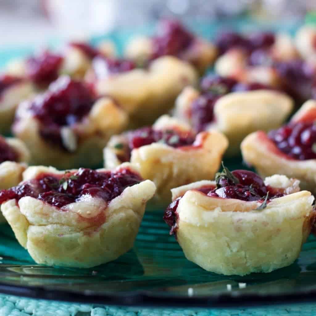 Cranberry Raspberry Brie Bites are a quick, easy appetizer. Pretty heathy and full of cranberry raspberry flavor!