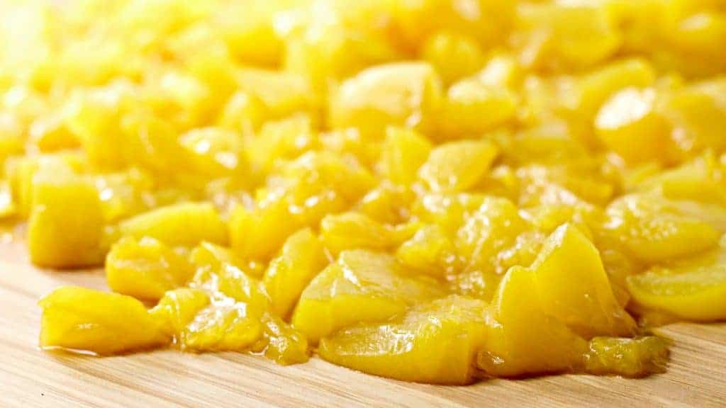 Canned, chopped peaches ready to make Mid Winter Cherry Peach Maple Ice Cream Recipe https://homemadefoodjunkie.1wp.site