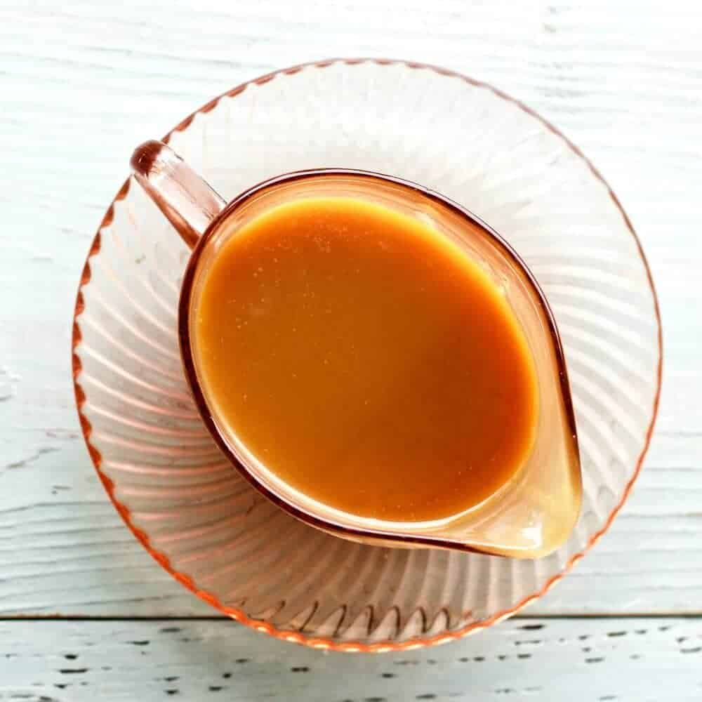 Homemade Buttermilk Caramel Sauce is Rich, thick and delicious. This sticky, buttery sauce uses real butter and buttermilk. The flavor is outstanding! You won't buy syrup for ice cream, desserts or pancakes after tasting this delectable sauce! https://homemadefoodjunkie.1wp.site