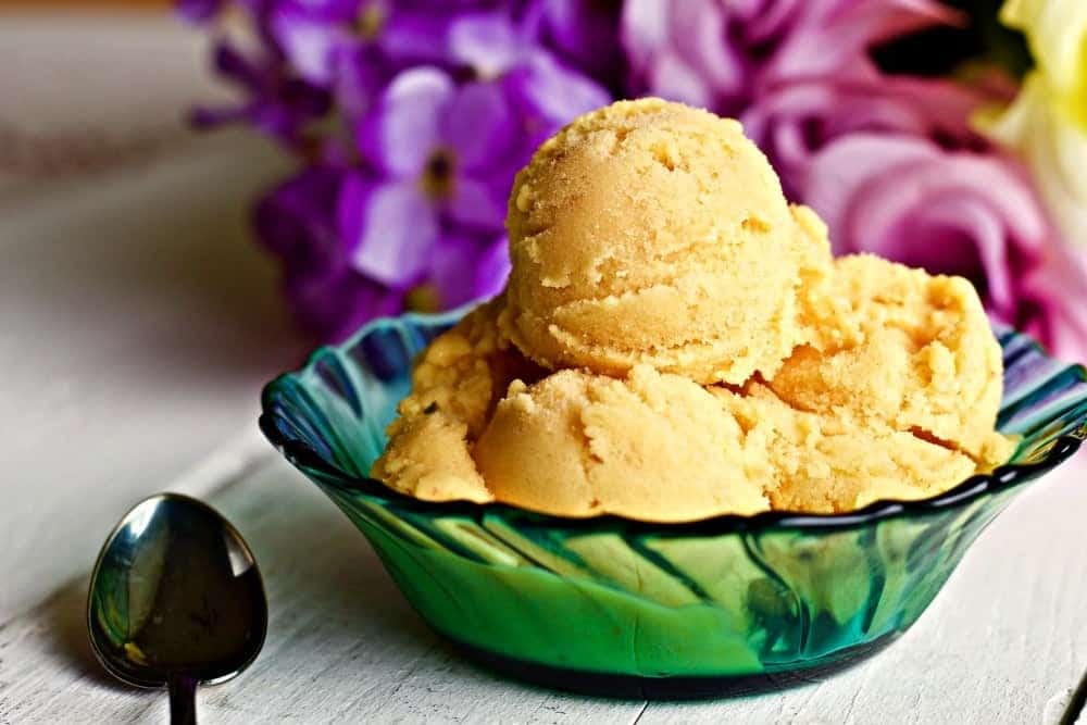 Mango Medley Ice Cream with real Pineapple, Mango and strawberries. Enjoy a fresh summer frozen treat with NO processed sugar! This is a nutritionally balanced, Low-Sodium, Vegetarian, Gluten-Free low calorie treat. https://homemadefoodjunkie.1wp.site