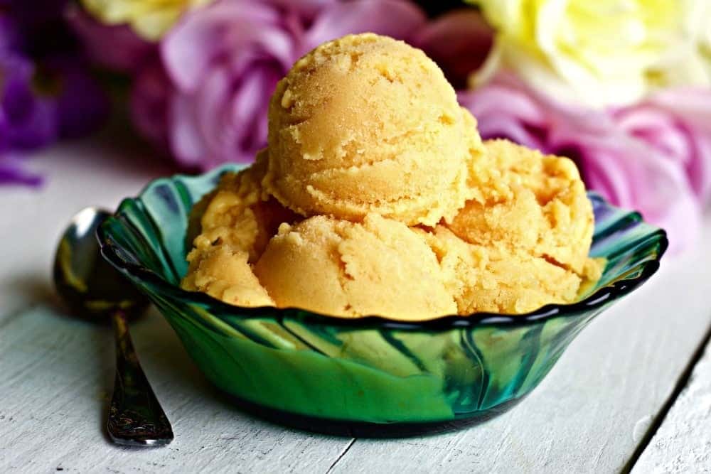 Mango Medley Ice Cream with real Pineapple, Mango and strawberries. Enjoy a fresh summer frozen treat with NO processed sugar! This is a nutritionally balanced, Low-Sodium, Vegetarian, Gluten-Free low calorie treat. https://homemadefoodjunkie.1wp.site