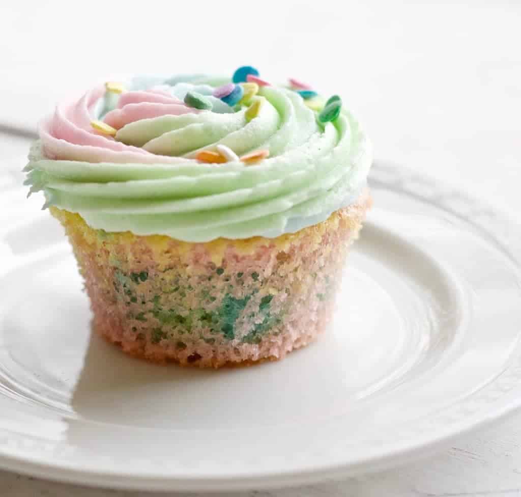 These adorable multi colored rainbow cupcakes are delicious, super cute and easy to make! Colorful and fun, they are sure to be a hit at any gathering.