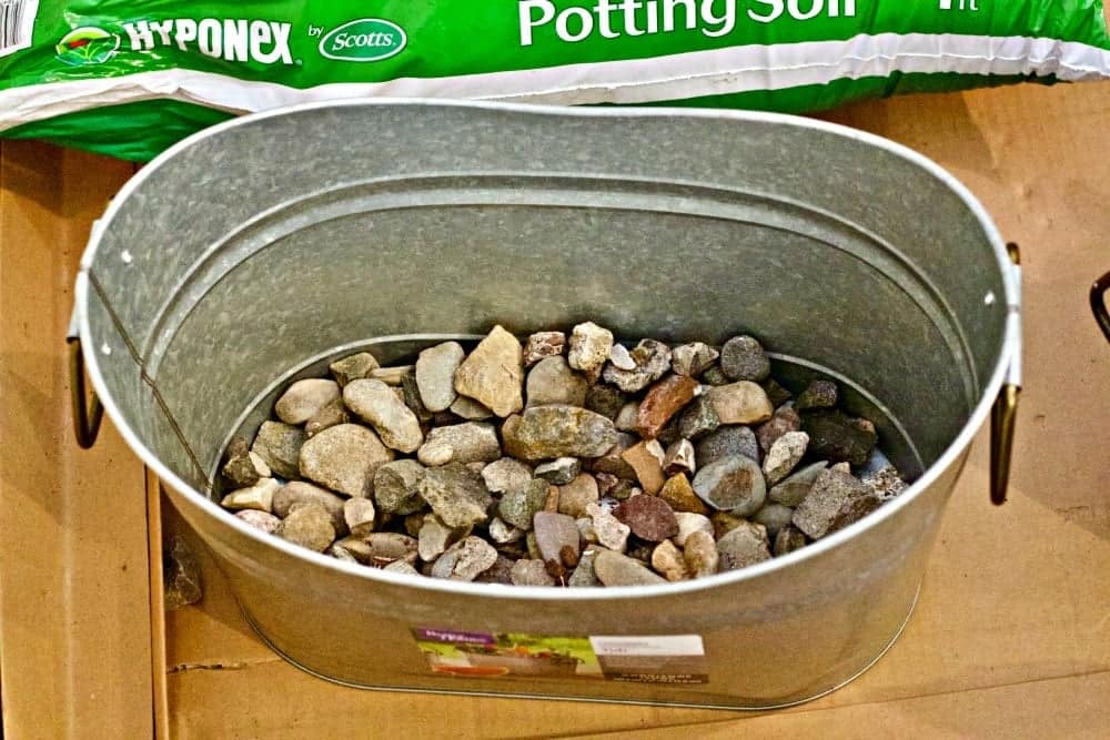 Rocks for drainage in container garden