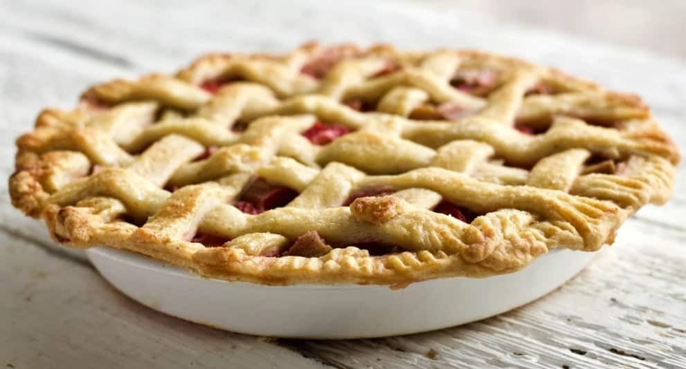 Strawberry Rhubarb Pie with a Sourdough Pie Crust in a white nine inch pie plate