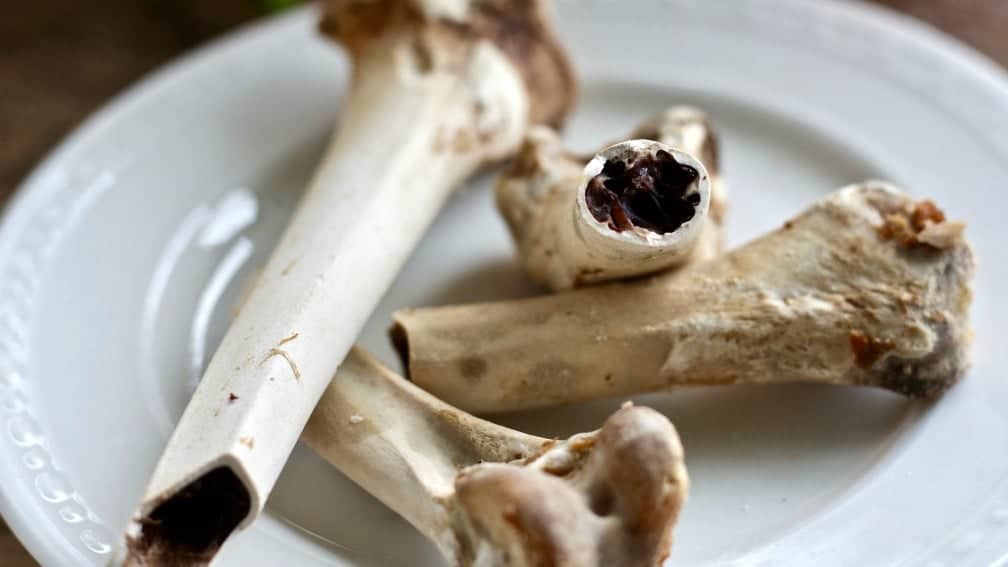 Instant pot Bone Broth is done when after four hours of high pressure cooking the bones crumble easily.
