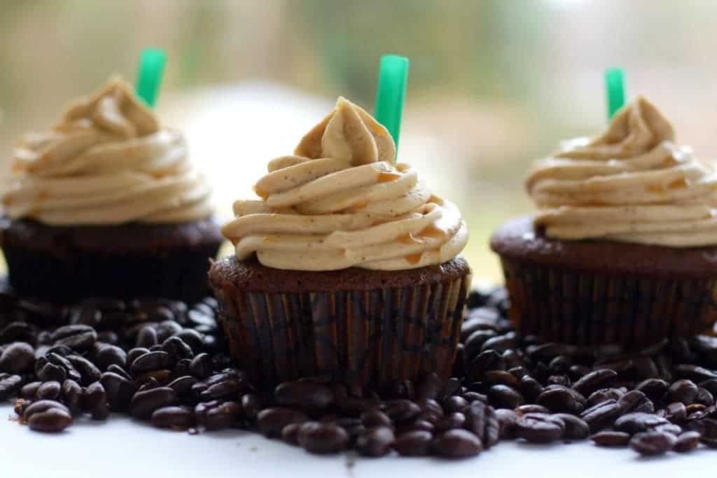 Mocha cupcakes with Espresso Buttercream Frosting surrounded by coffee beans
