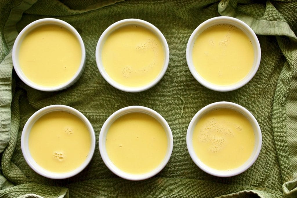 ramekins with creme brulee custard. Ready to bake.