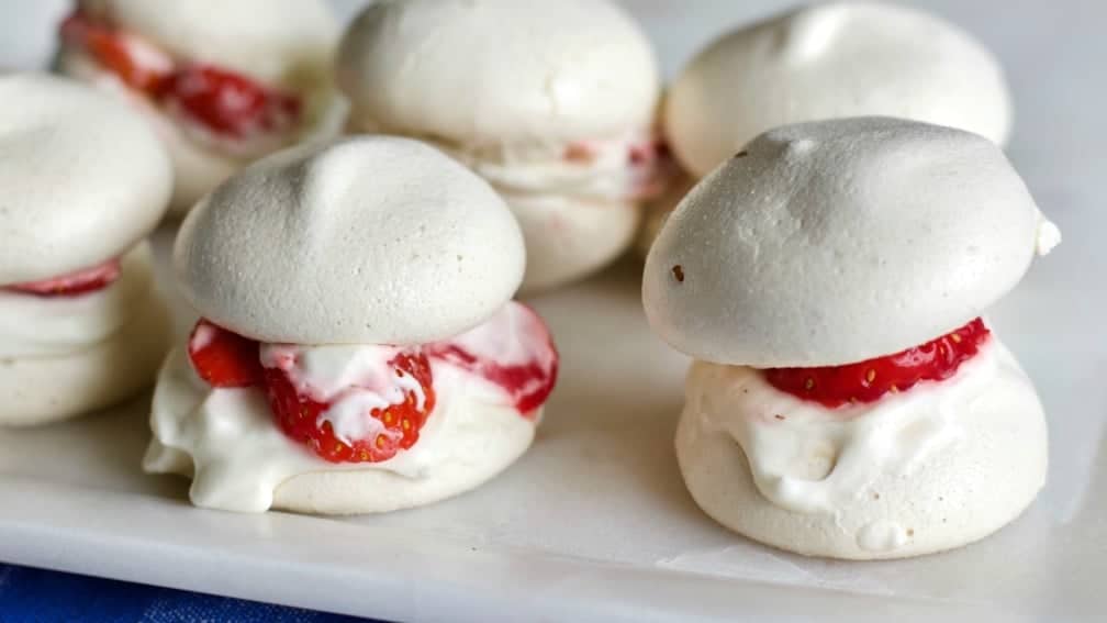 These yummy Double Stuffed berry Meringues are perfect party food. Fill the meringues with your favorite berries and cream for a delicious light appetizer or family night dessert. Easily made with Children. How do I know? My grandkids and I made these.