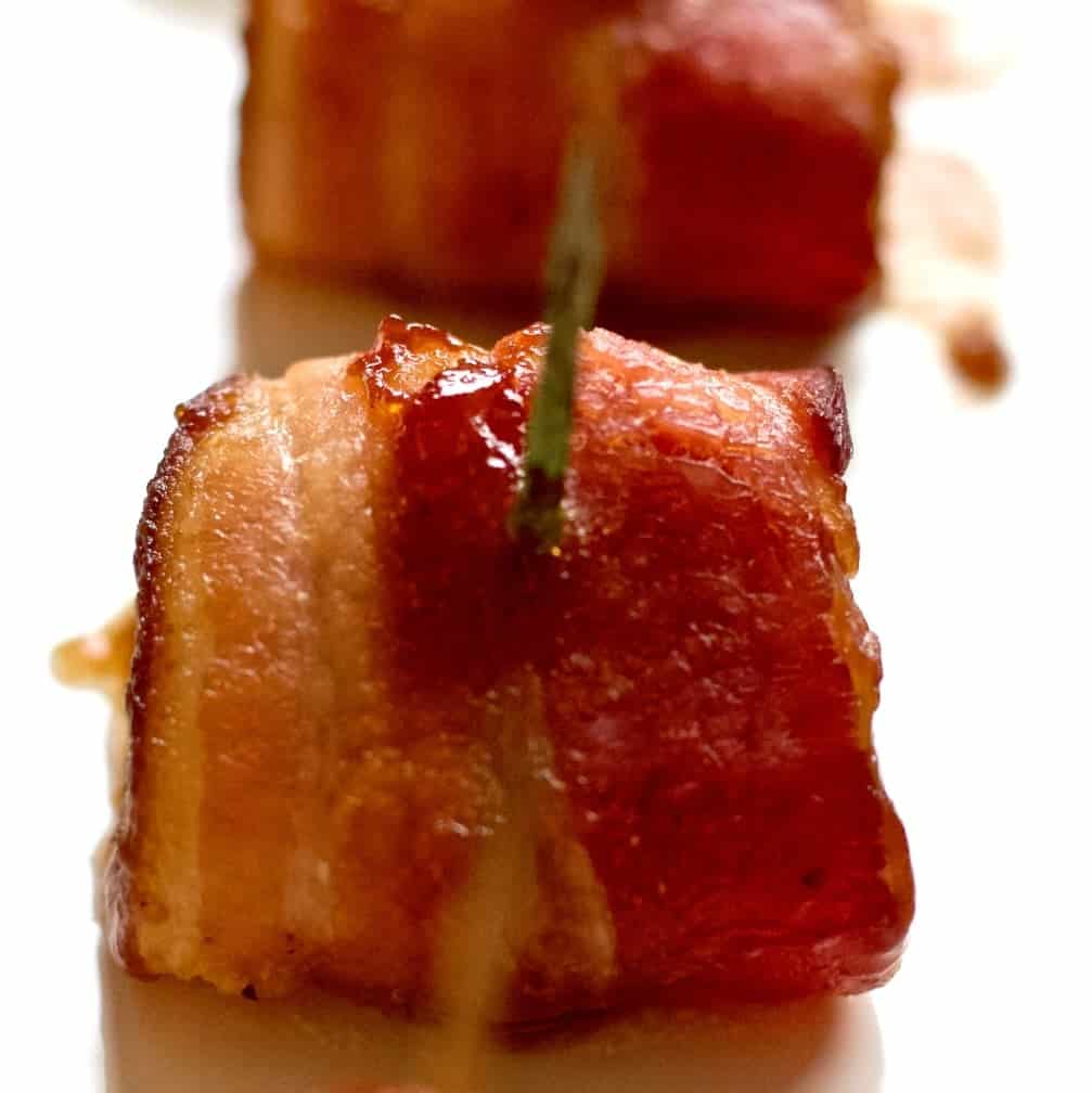 bacon wrapped water chestnuts on a serving tray