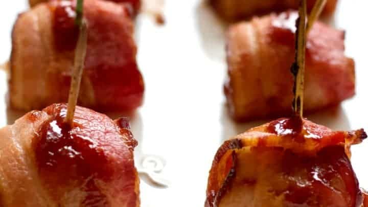 bacon wrapped water chestnuts on a serving tray