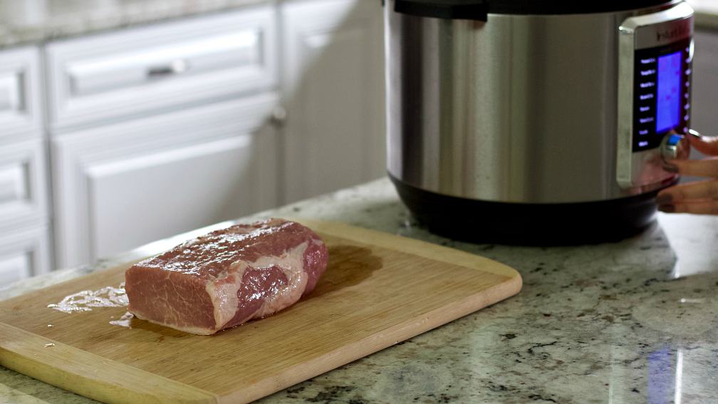 raw pork roast on board.