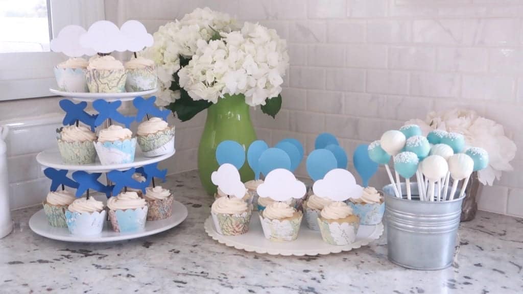 Baby Shower Cupcakes on platters with white hydrangeas and a can of cake pops