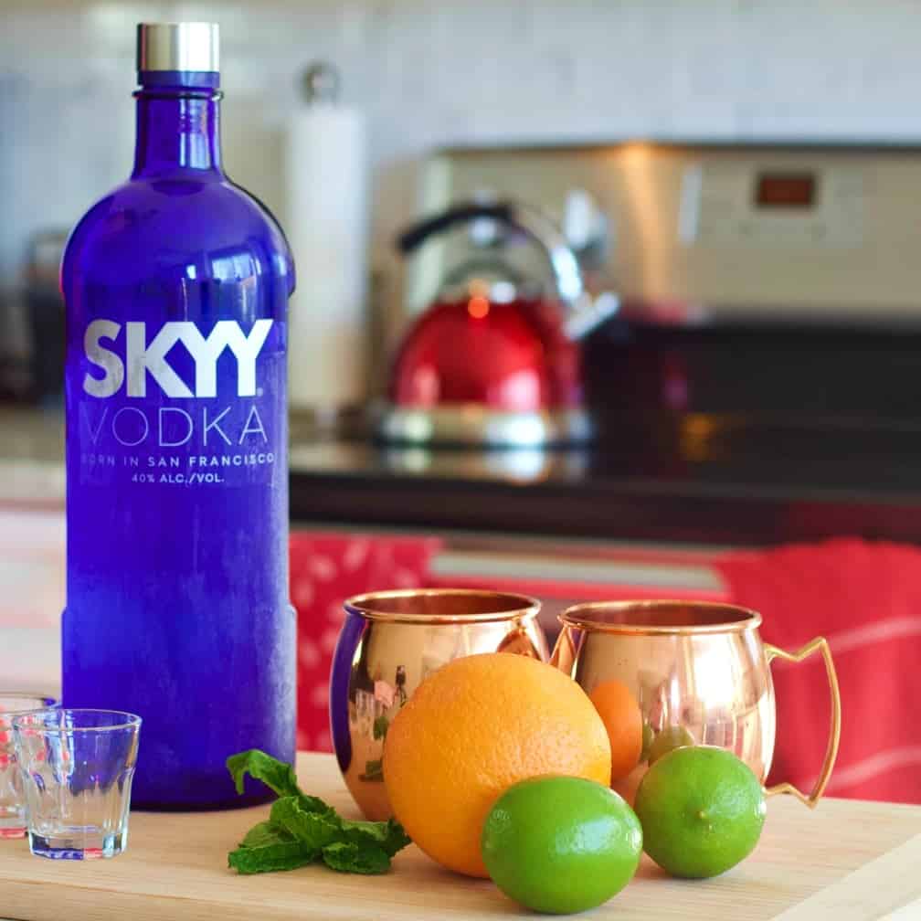 some of the ingredients for this vodka drink and copper mugs.