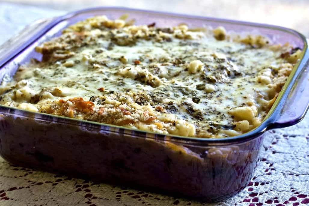 Noodle Casserole with Ham recipe in a cranberry colored 8 x 8 baking dish