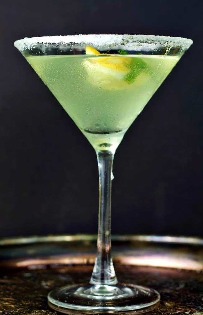 Long side shot of the rimmed and garnished lemon drop martini with limoncello.