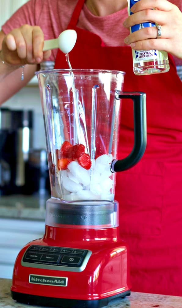 Strawberry Daiquiri Recipe with Malibu Coconut Rum 10 Pouring in the simple syrup