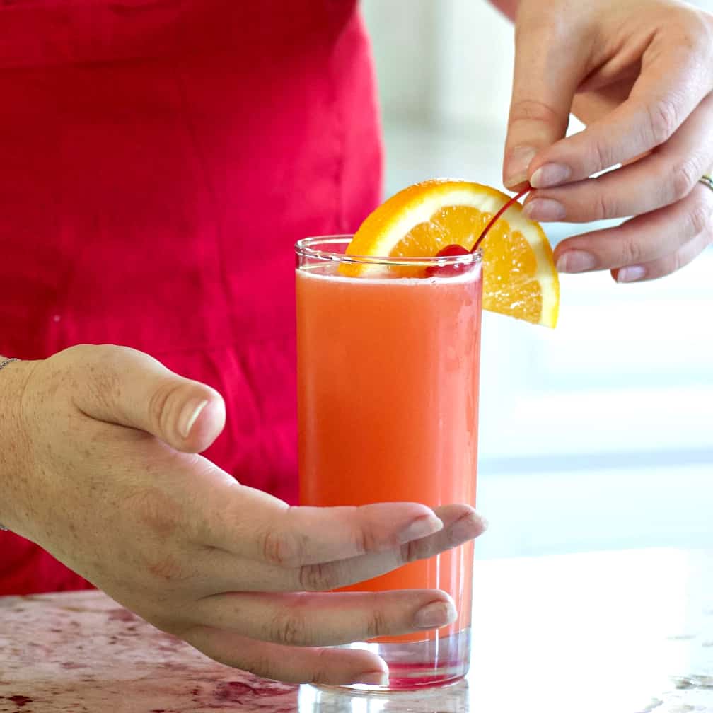 Garnish rum punch with an orange slice and a cherry