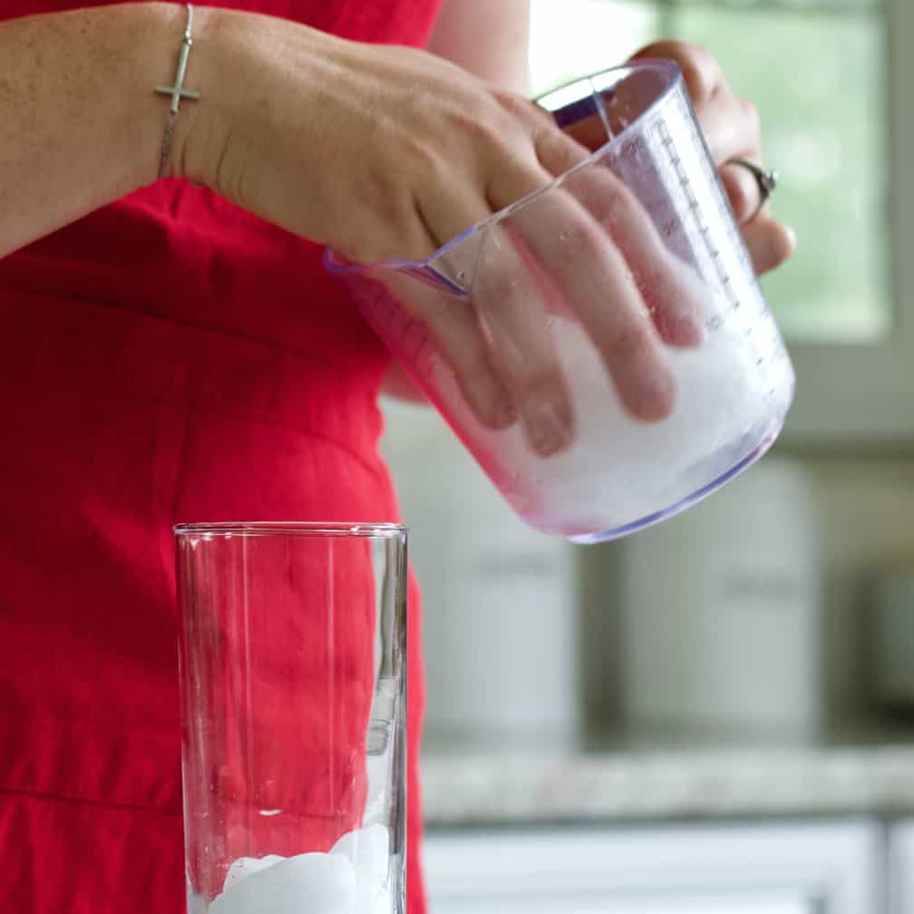 Filling a tom collins glass with ice