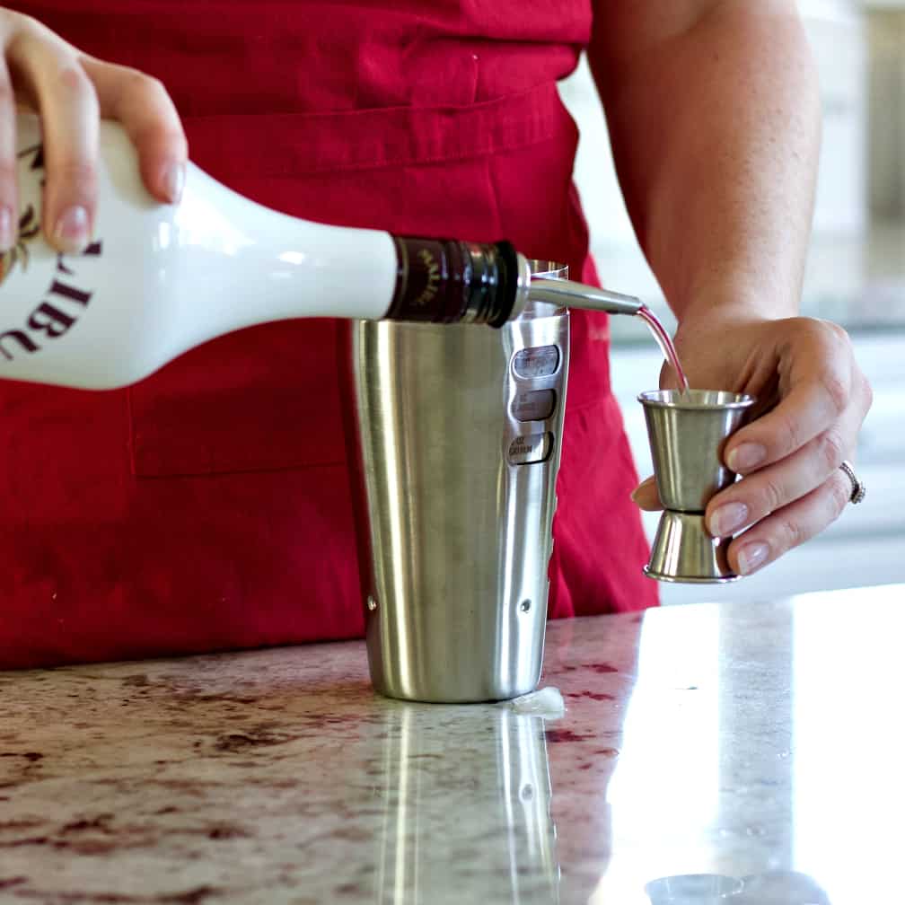 pouring malibu rum-bayou rum punch