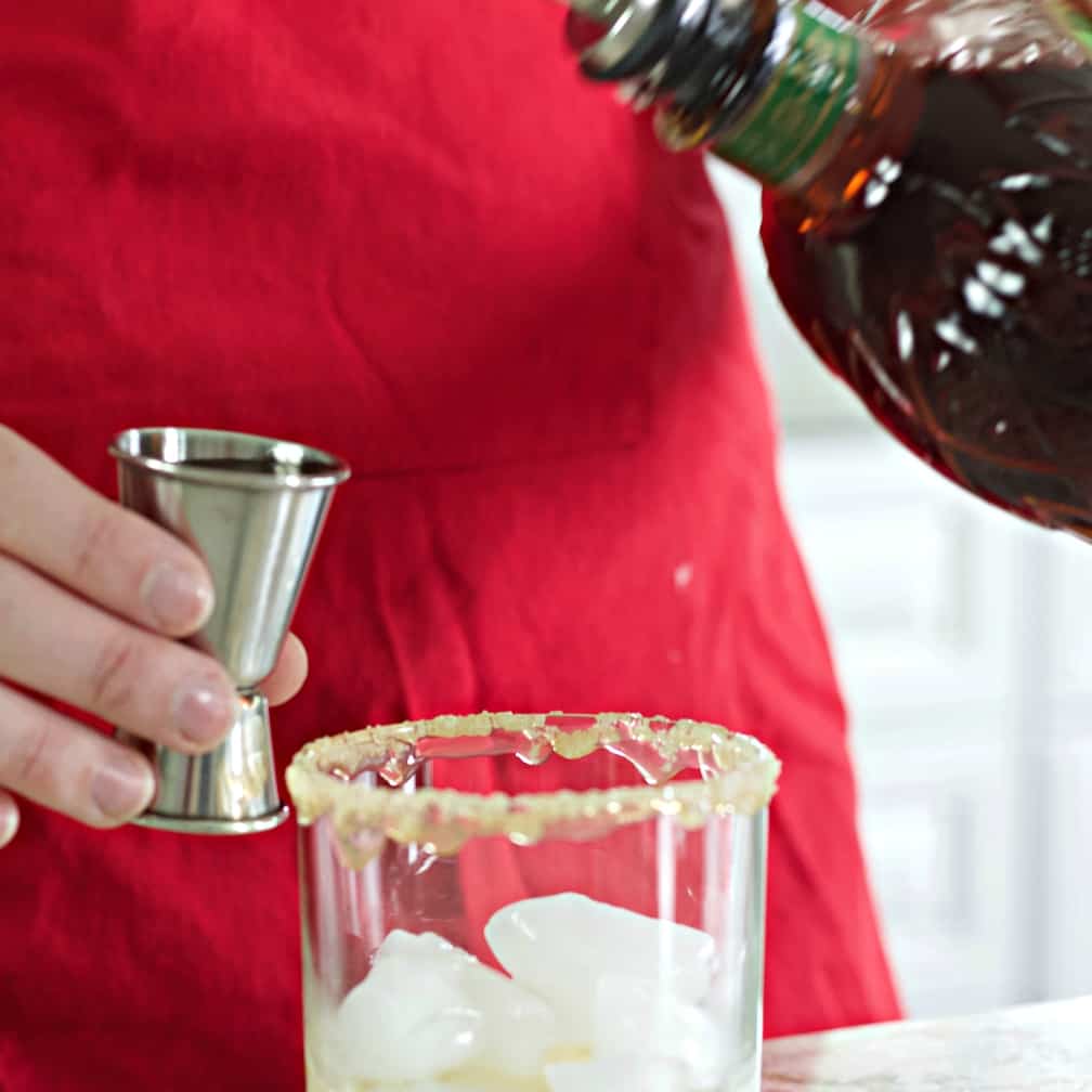 measure and pour the apple crown whiskey